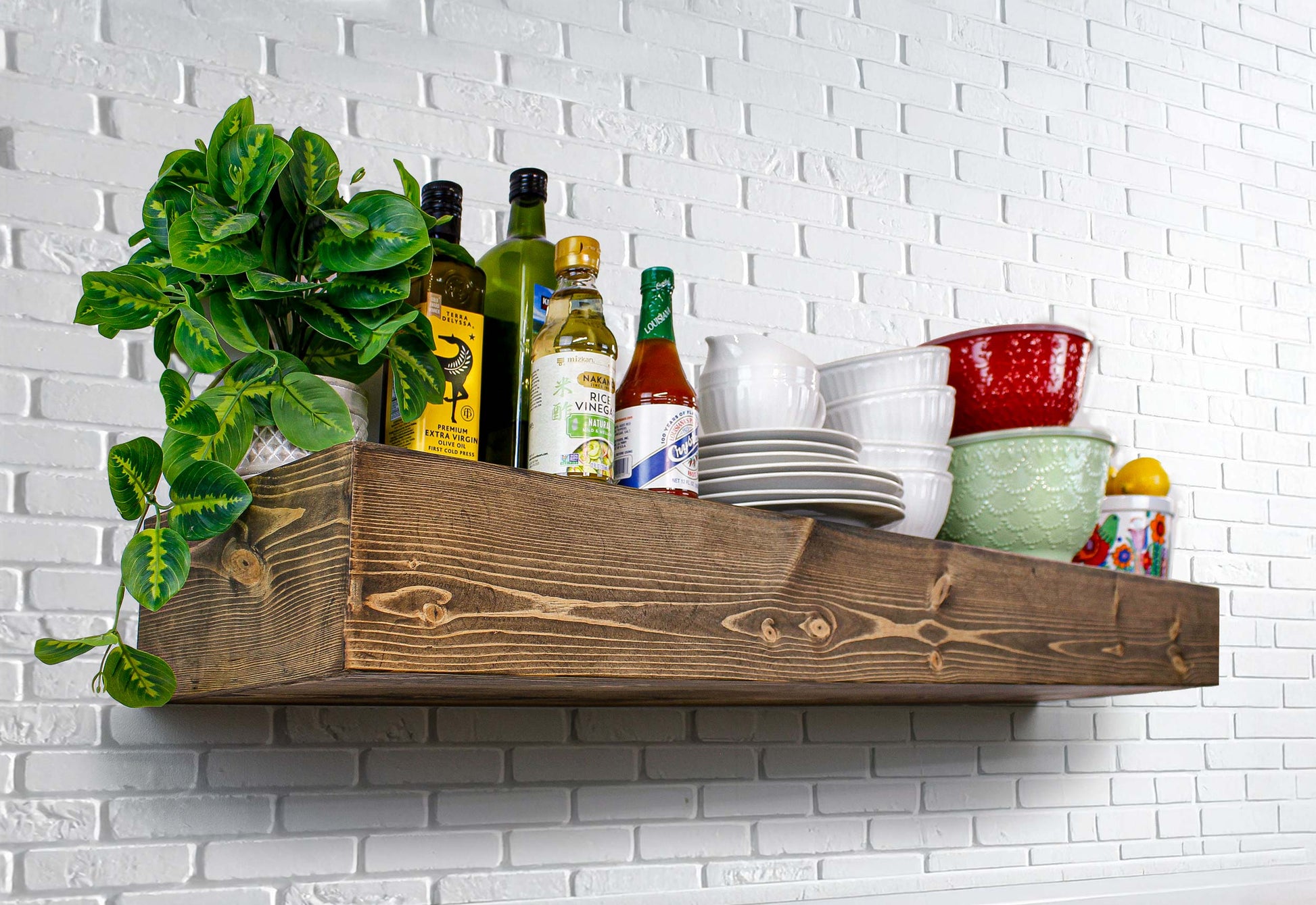 Dress up your kitchen with a natural wood stained timber beam pine tree floating shelf. The natural wood is very attractive in the modern urban kitchen against subway tile to hold cooking and serving essentials storage and colorful display. Easy to hang and heavy duty solid wood built to last handmade in USA with love and care. Rustic Shelves Floating Wall Shelf Wooden Pine Timber Beam Farmhouse Country Kitchen