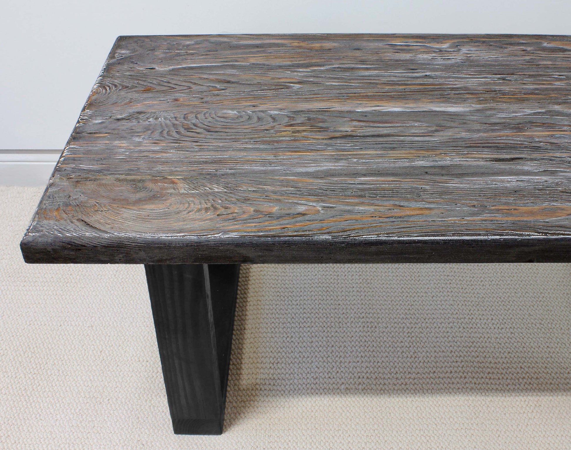 Wooden table with a rustic finish on a plain background