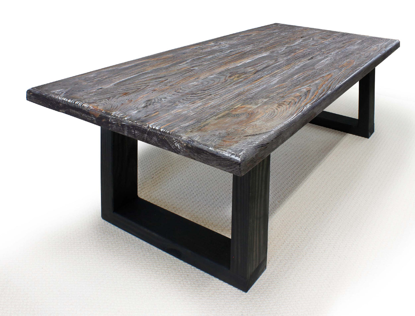 Dining table with stone-like top and black metal legs on a white background
