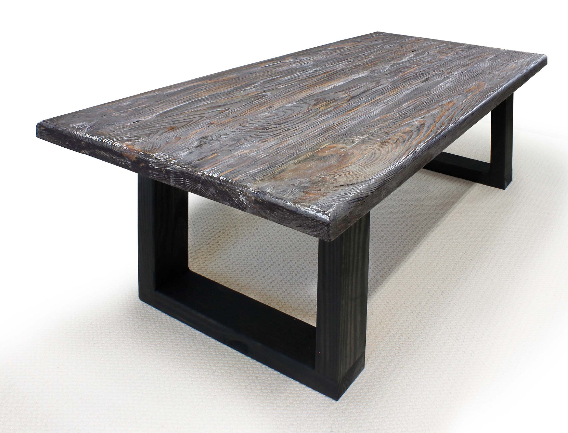 Dining table with stone-like top and black metal legs on a white background