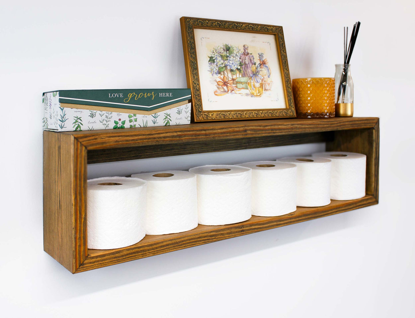 The long shelves hold 6 mega toilet paper rolls in a nice neat display for easy to find toiletries for family and guests displayed attractively, the wall mounted cabinet is versatile heavy duty multipurpose in a home or office functional and beautiful mid century modern decor vibes | a great housewarming gift or wedding present because it is heavy duty quality handcrafted in USA from locally sourced pine solid wood