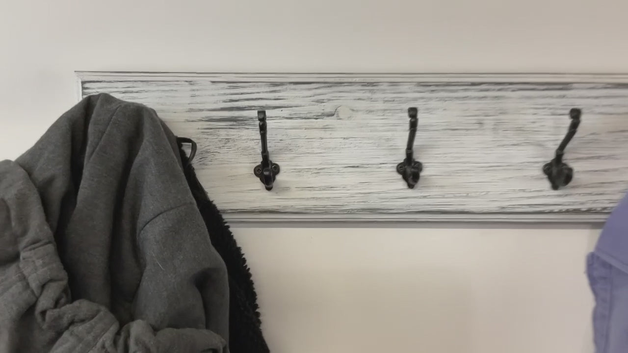 farmhouse decor wall mount wood coat rack distressed white paint over black with black victorian style hooks 